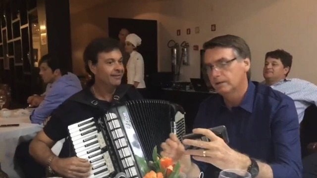 Gilson Machado ao lado de Bolsonaro em transmissão na internet Reprodução / Youtube